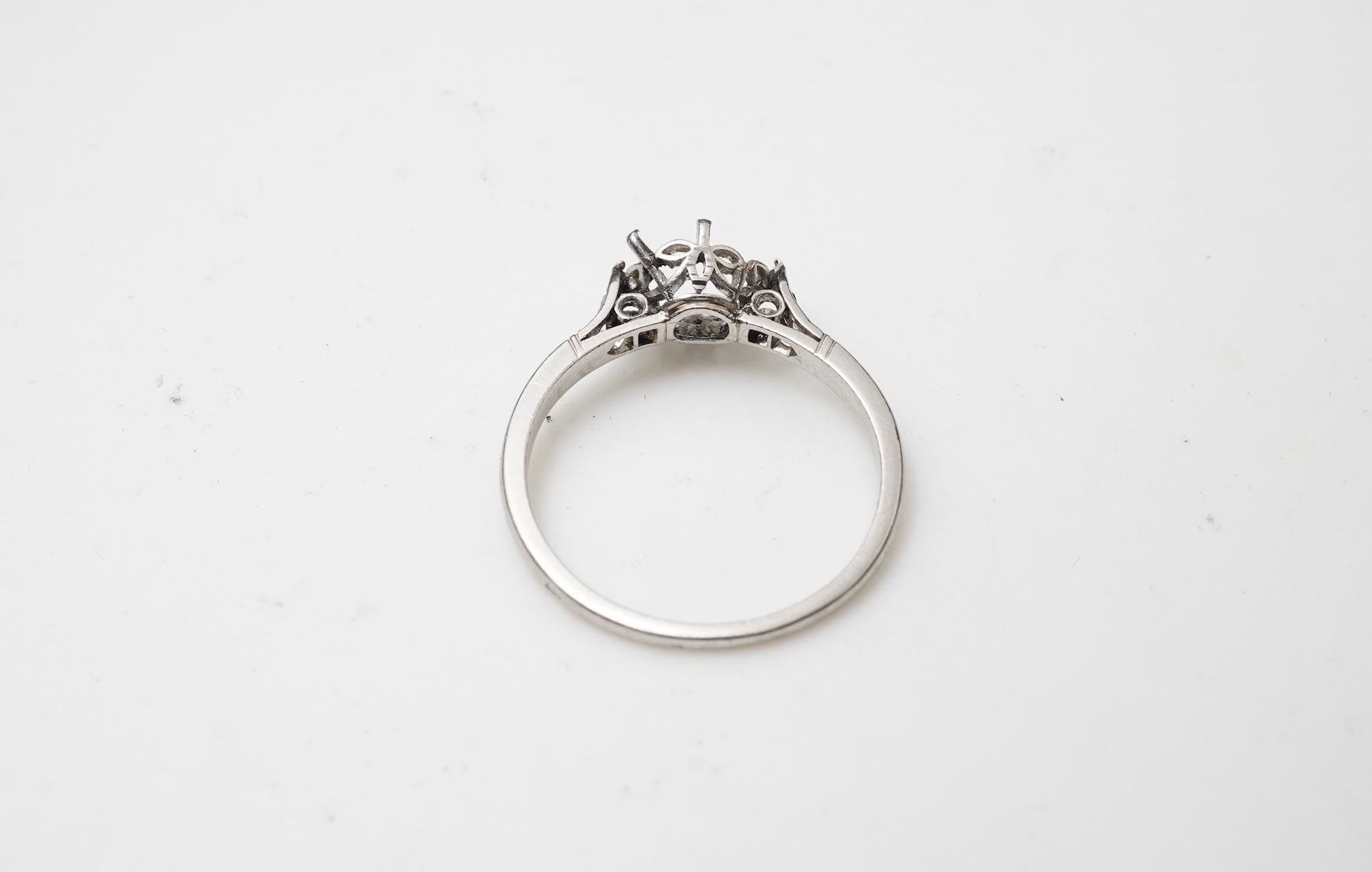A platinum and diamond ring mount, France, early 20th century